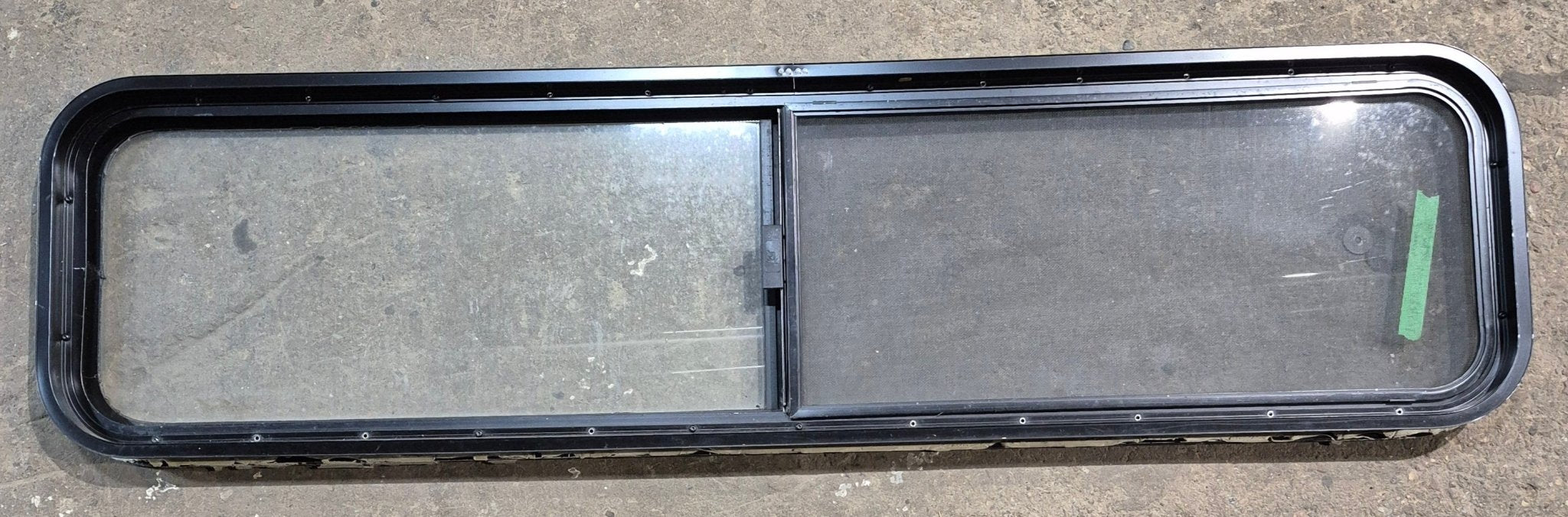 Used Black Radius Opening Window : 59 1/4" W x 14 1/2" H x 1 7/8" - Young Farts RV Parts