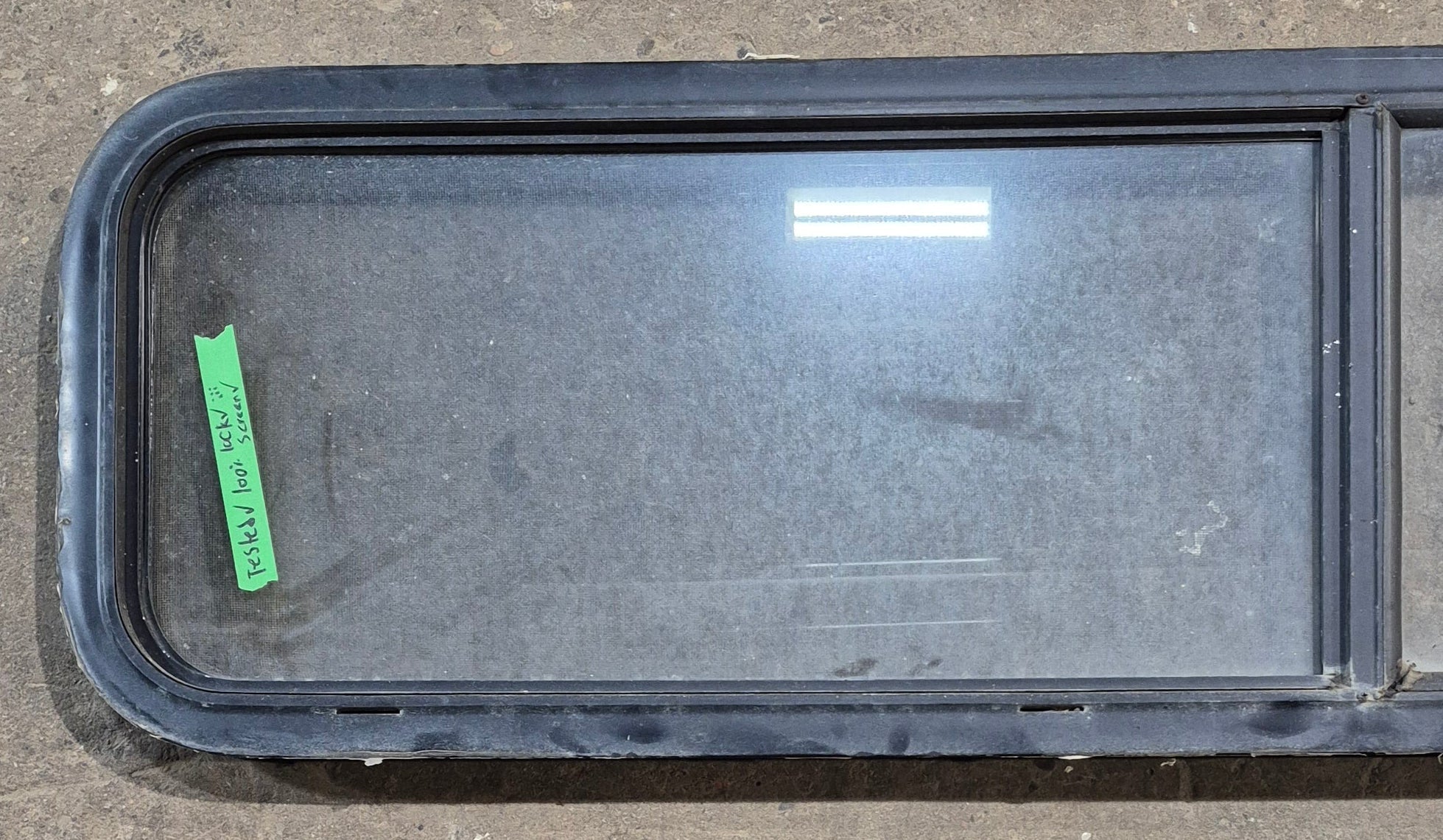 Used Black Radius Opening Window : 59 1/4" W x 14 1/2" H x 1 7/8" - Young Farts RV Parts