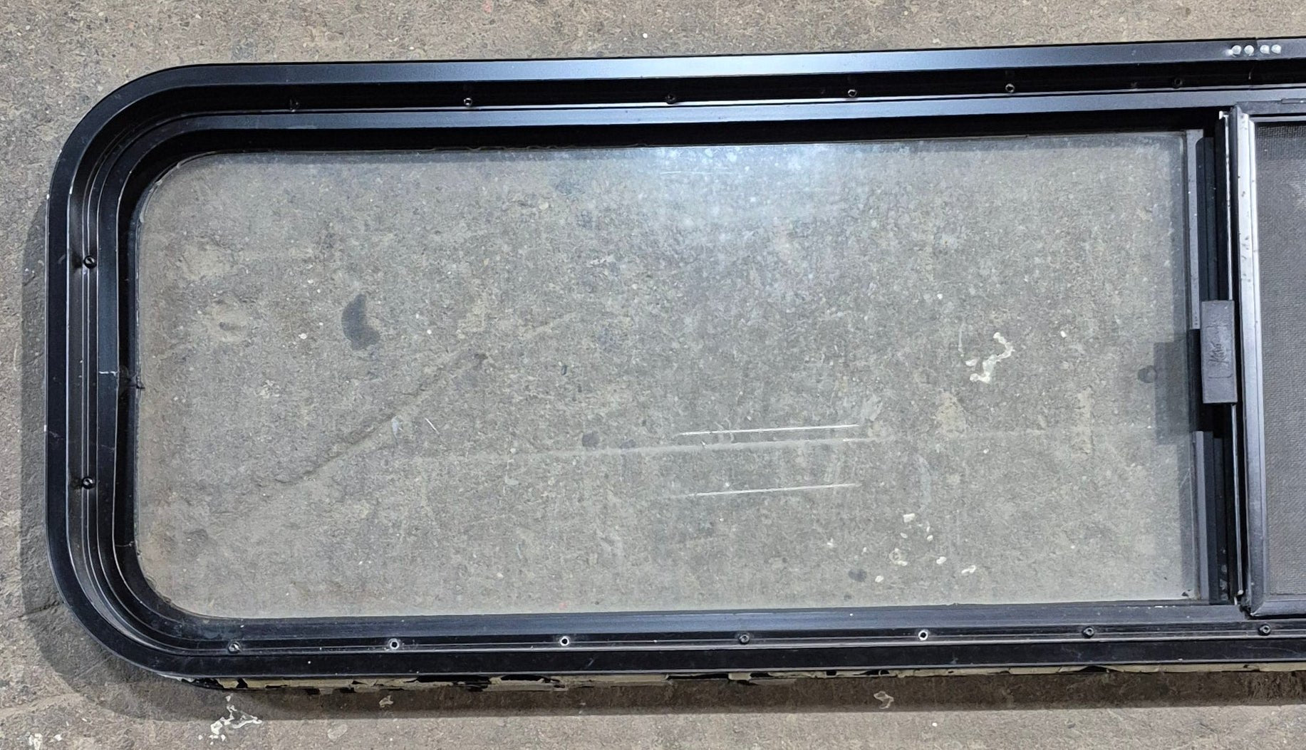 Used Black Radius Opening Window : 59 1/4" W x 14 1/2" H x 1 7/8" - Young Farts RV Parts