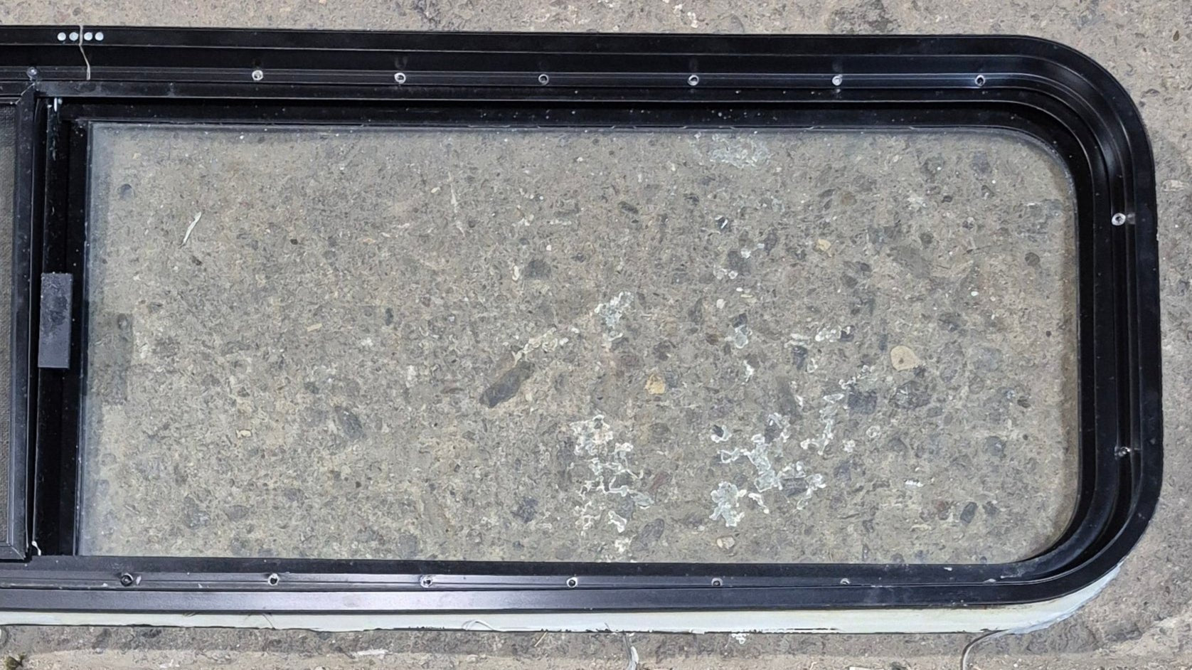 Used Black Radius Opening Window : 59 1/4" W x 14 1/4" H x 1 3/4" - Young Farts RV Parts