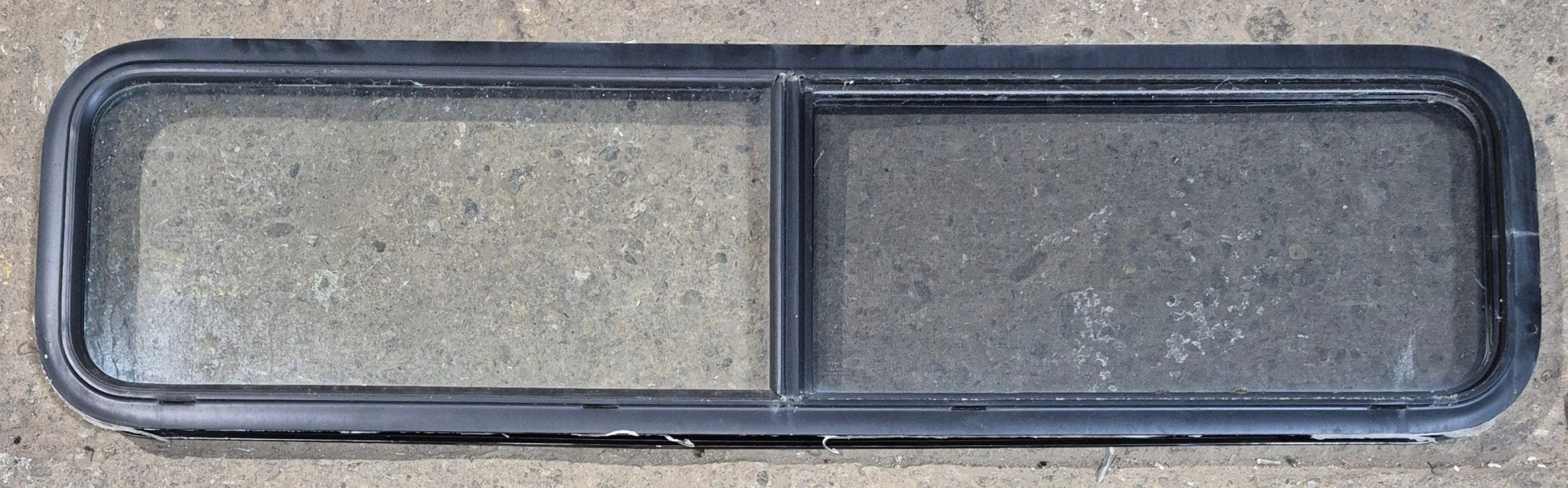 Used Black Radius Opening Window : 59 1/4" W x 14 1/4" H x 1 3/4" - Young Farts RV Parts