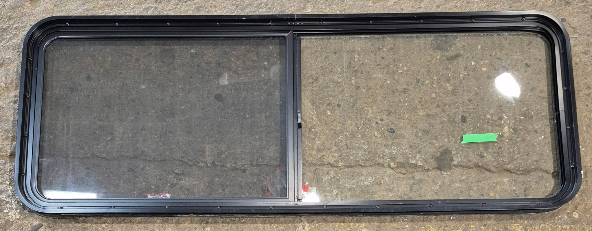 Used Black Radius Opening Window : 60 1/4" W x 21 3/4" H x 1 3/4" - Young Farts RV Parts