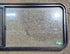 Used Black Radius Opening Window : 60 1/4" W x 21 3/4" H x 1 5/8" D - Young Farts RV Parts