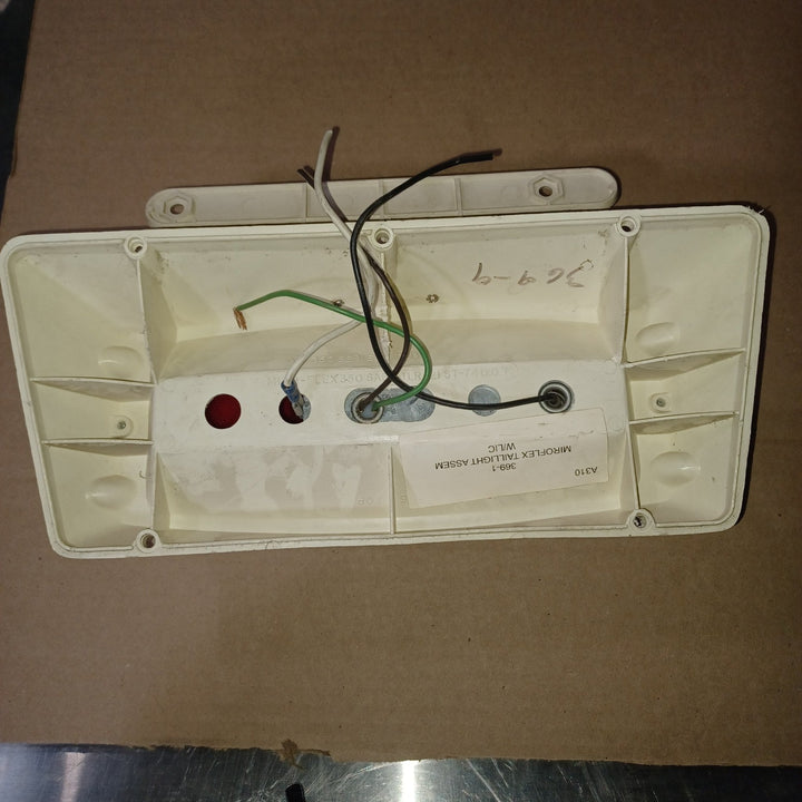 Used Microflex SAE-AILR(2) ST-72 D.O.T Taillight Assembly, With License Plate Bracket - Young Farts RV Parts
