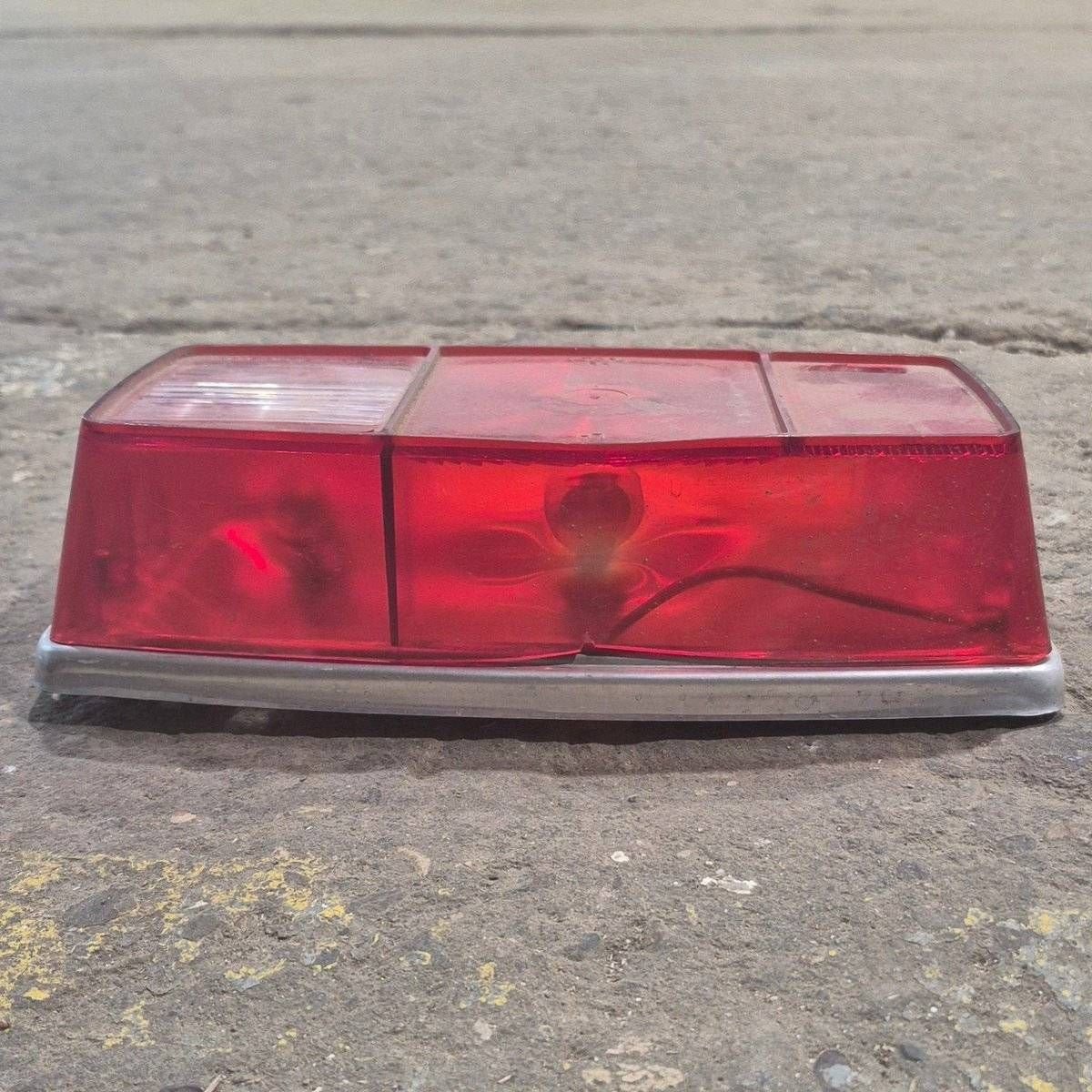 Used Miro-Flex RV Tail Light Assembly, With License Plate Bracket, 10 1/8