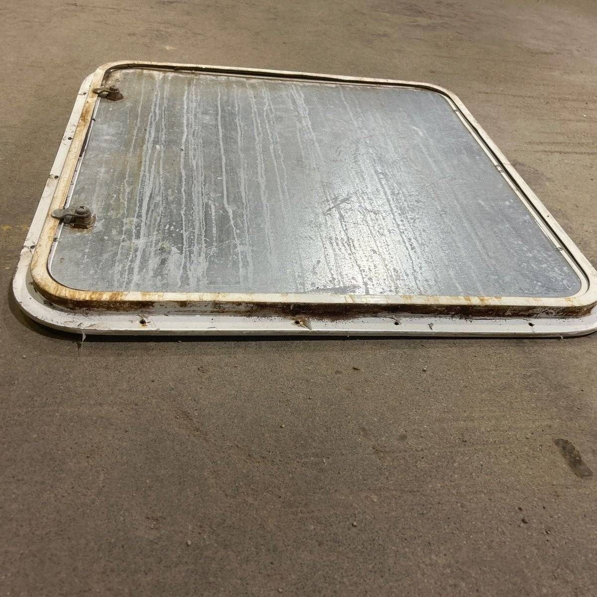Used Radius Corner Cargo Door - 23.5 X 23.75 X 0.75 - Young Farts RV Parts