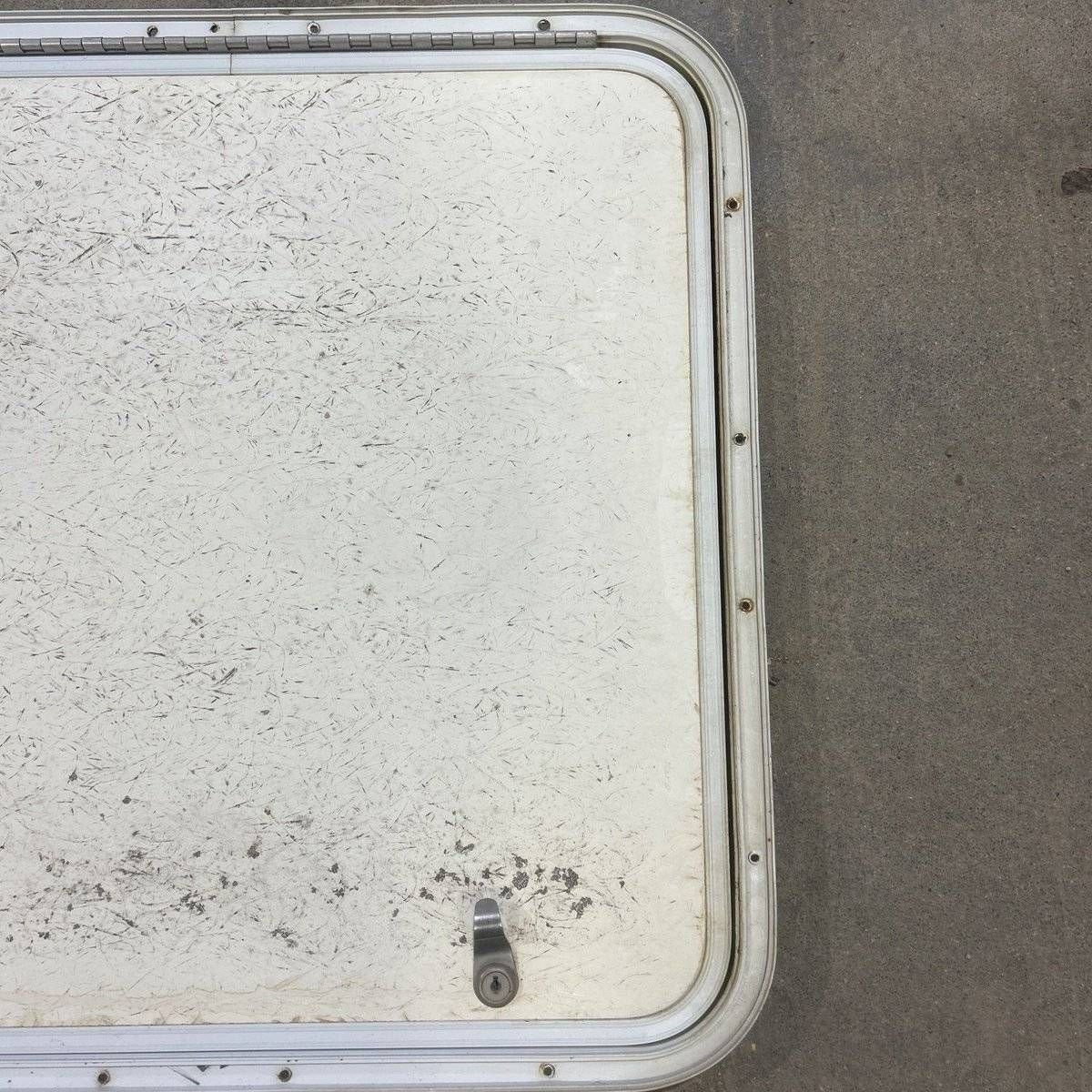 Used Radius Corner Cargo Door - 23.5 X 23.75 X 0.75 - Young Farts RV Parts