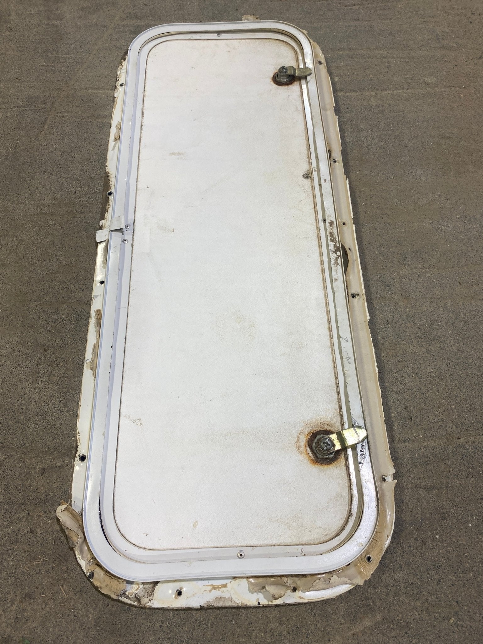 Used Radius Corner Cargo Door 29 3/4" W x 10 3/4" H x 3/4" D - Young Farts RV Parts