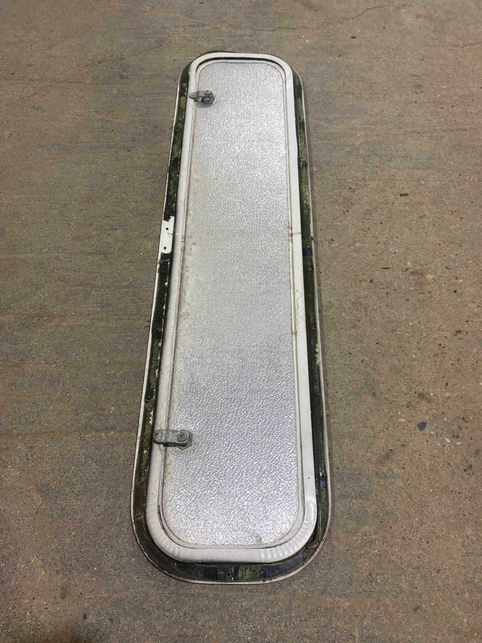 Used Radius Corner Cargo Door 35 1/2" W x 7 3/4" H x 3/4" D - Young Farts RV Parts