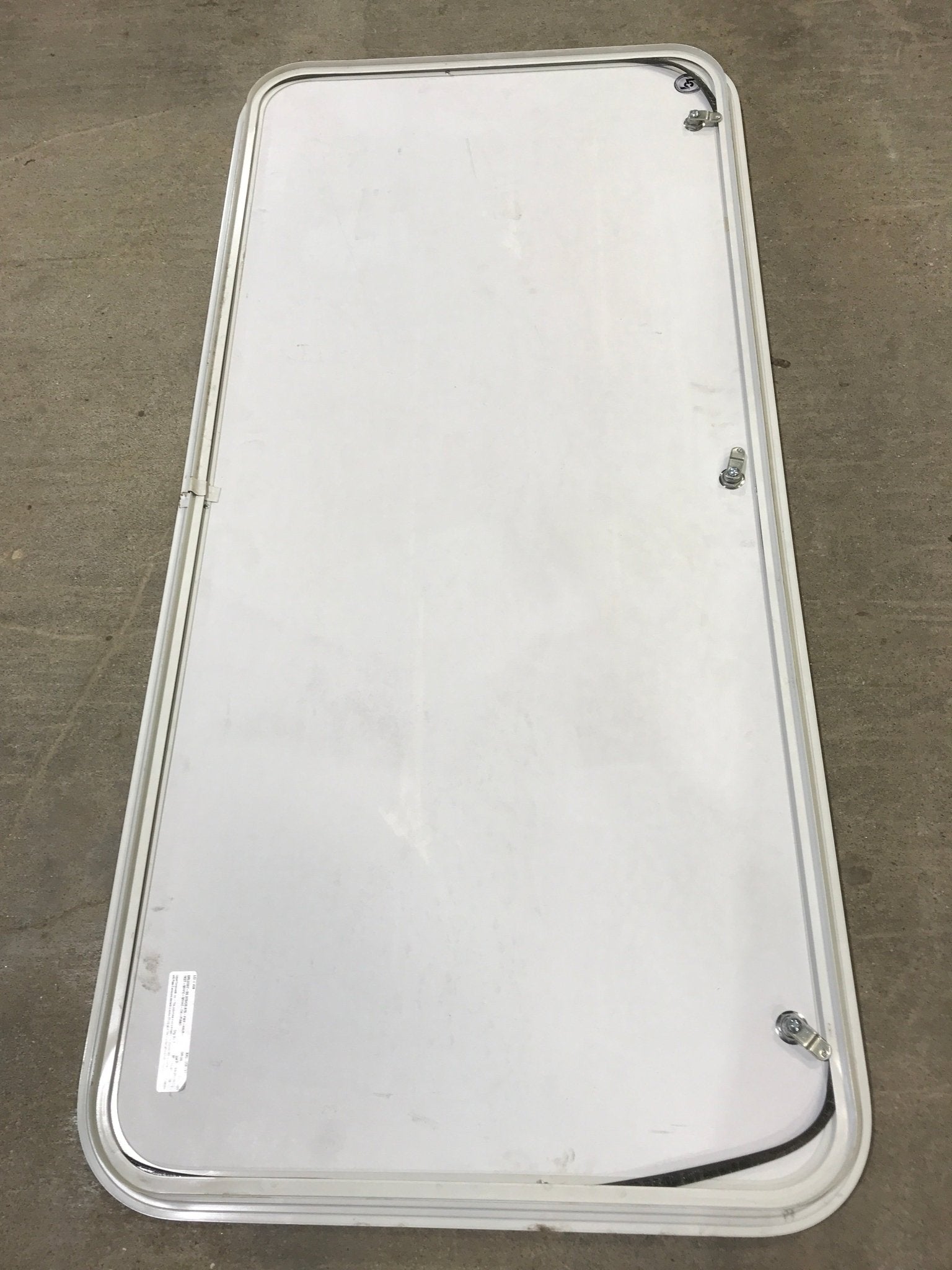 Used Radius Cornered Cargo Door 55" x 25 1/2" x 1" D - Young Farts RV Parts