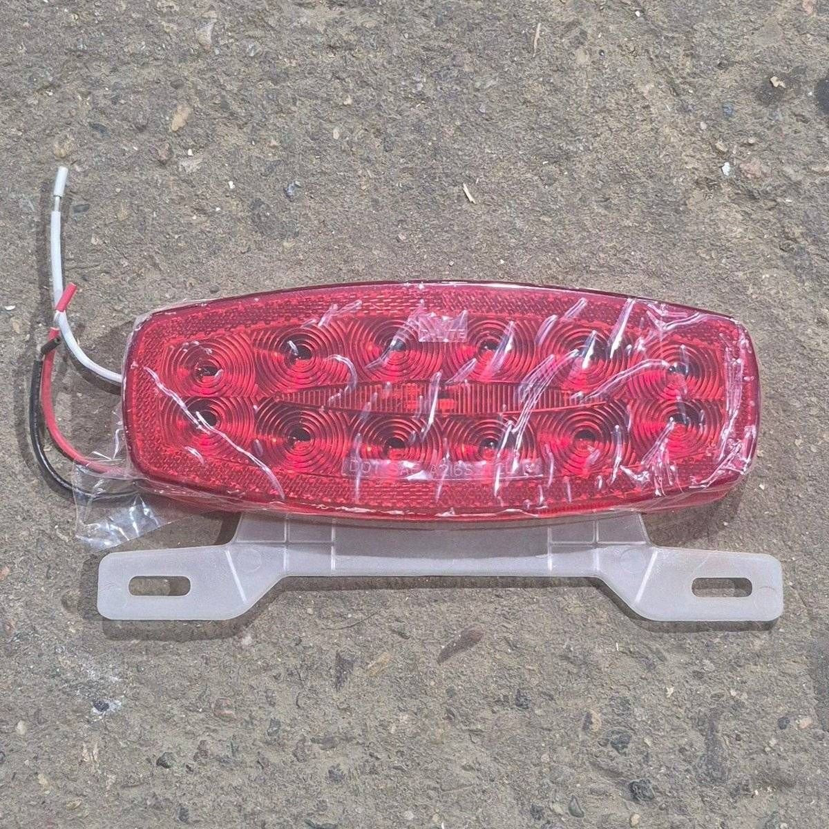Used RV Tail Light Assembly, With License Plate Bracket, 8.625" x 4.125" x 1.25"- DOT SAE A2I6S2T2L 18 - Young Farts RV Parts