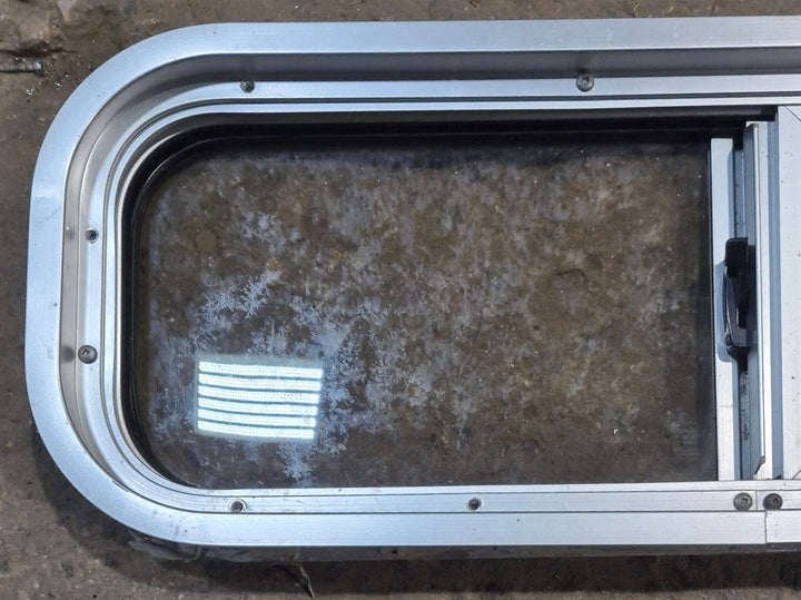 Used Silver Radius Opening Window : 26 1/2" W x 8 1/2" H x 1 3/4" D - Young Farts RV Parts