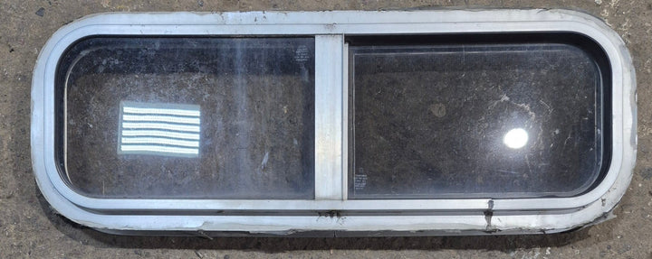 Used Silver Radius Opening Window : 26 1/2" W x 8 1/2" H x 1 3/4" D - Young Farts RV Parts