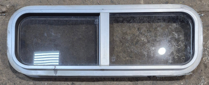 Used Silver Radius Opening Window : 26 1/2" W x 8 1/2" H x 1 3/4" D - Young Farts RV Parts