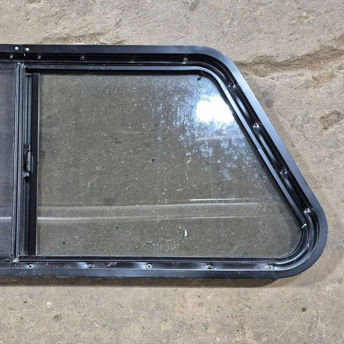 Used Slanted Black Radius Opening Window - 41 1/4" X 17 3/4" X 2" - Young Farts RV Parts
