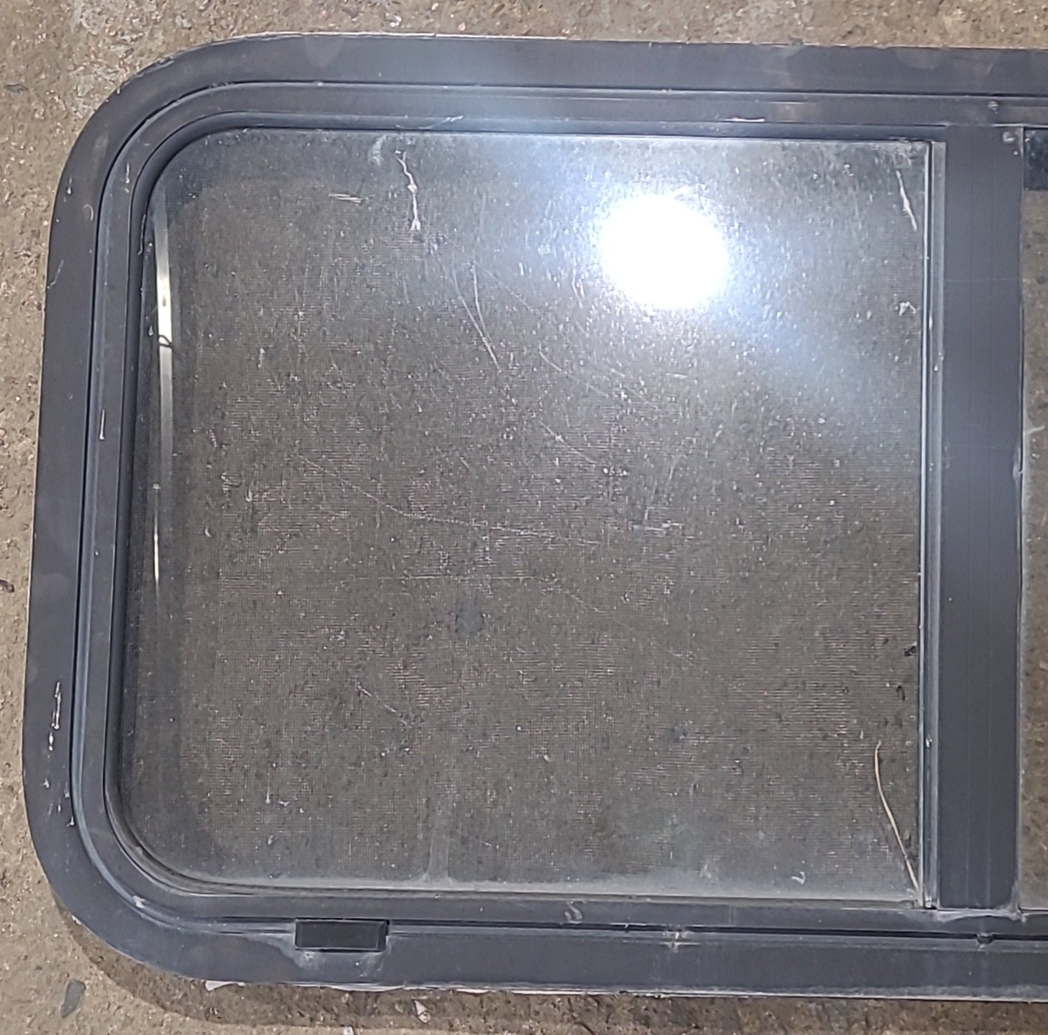 Used Slanted Black Radius Opening Window : 41 3/4" W x 17 3/4" H x 1 7/8" D - Young Farts RV Parts