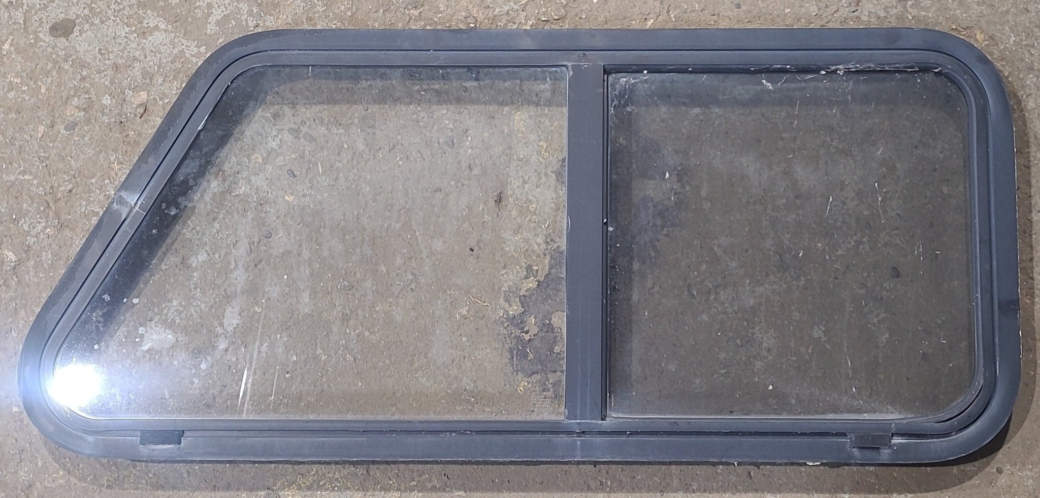 Used Slanted Black Radius Opening Window : 41 3/4" W x 17 3/4" H x 1 7/8" D - Young Farts RV Parts