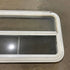 Used Slanted White Radius Emergency Opening Window - 49.25" x 23.25" x 1.875" - Young Farts RV Parts
