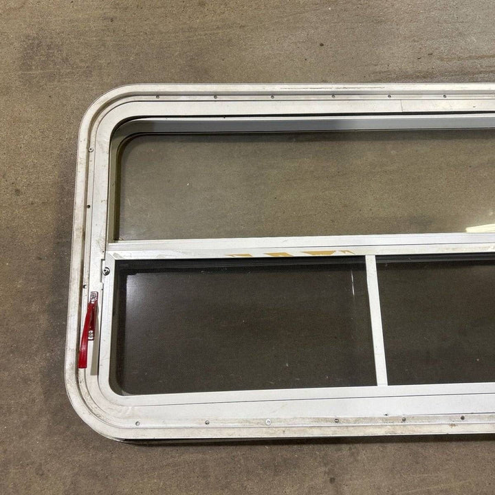 Used Slanted White Radius Emergency Opening Window - 49.25" x 23.25" x 1.875" - Young Farts RV Parts