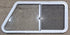 Used Slanted White Radius Opening Window : 46 3/4" W x 21 1/4" H x 1 1/4" D - Young Farts RV Parts