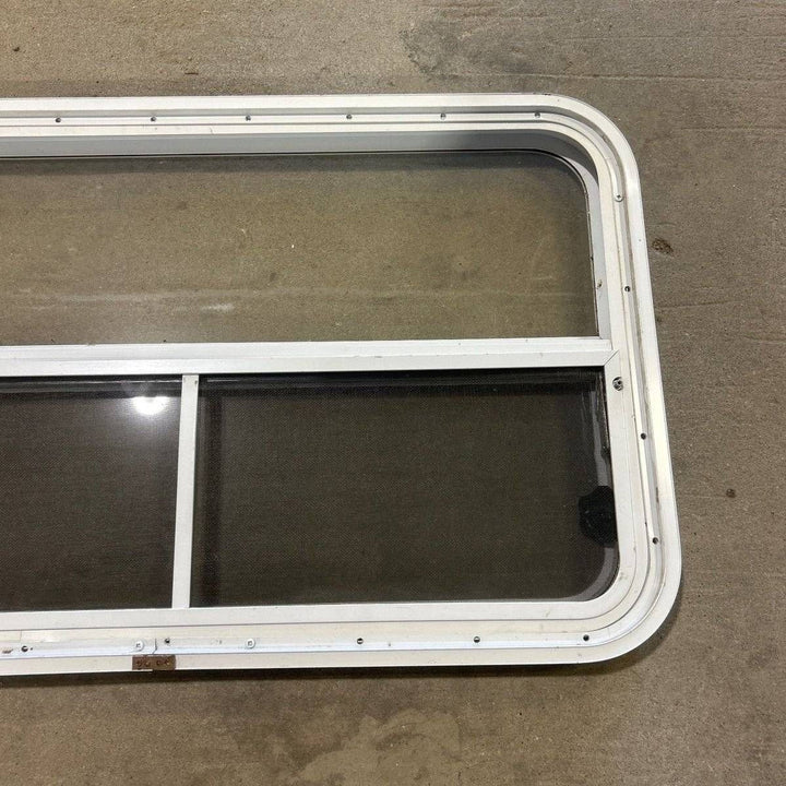 Used Slanted White Radius Opening Window - 49.25" x 23.25" x 1.875" - Young Farts RV Parts