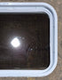 Used White Radius Non Opening Window : 24 1/4" W x 16 3/4" H x 1 7/8" D - Young Farts RV Parts