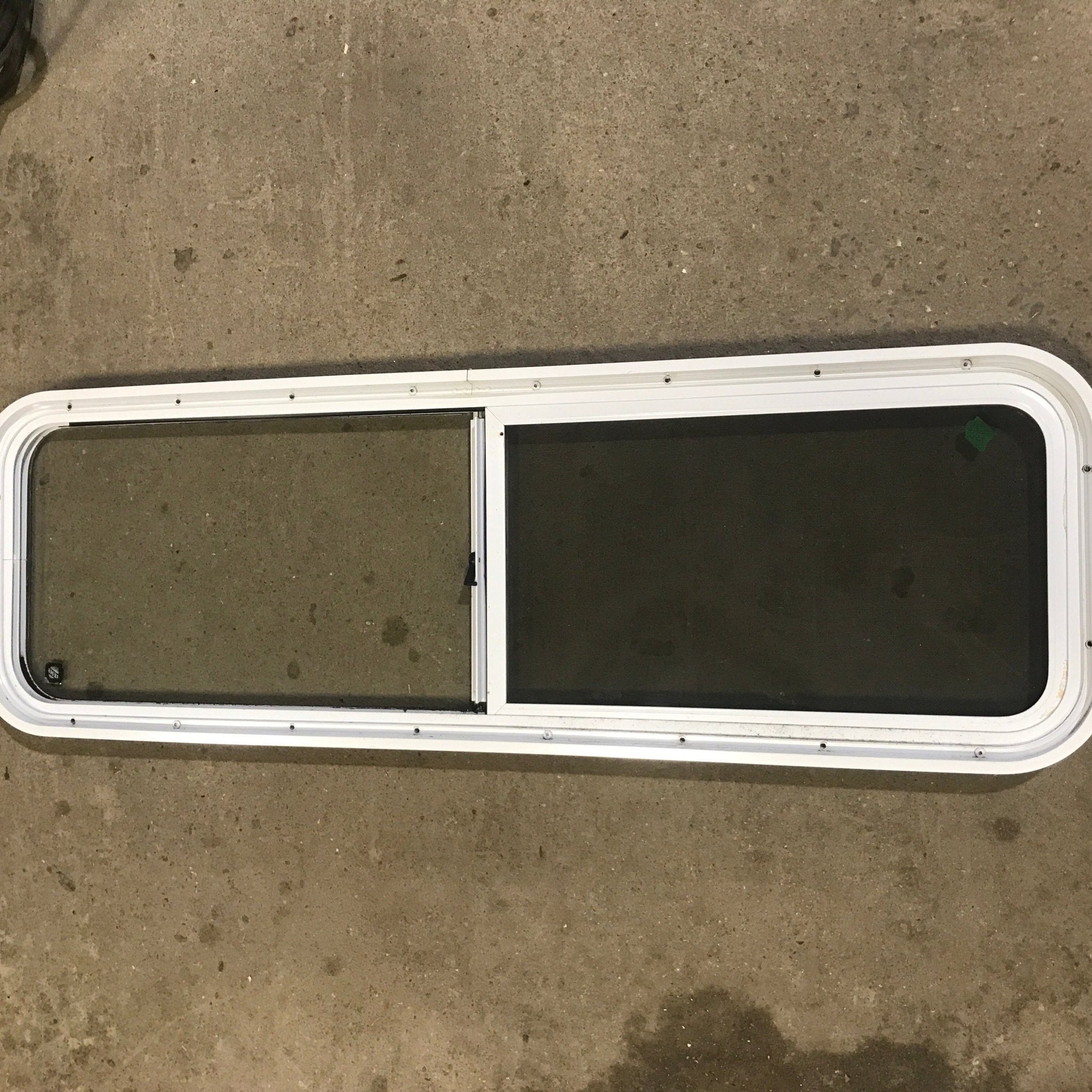 Used White Radius Opening Window : 48" W x 14 3/4" H x 1 7/8" D - Young Farts RV Parts