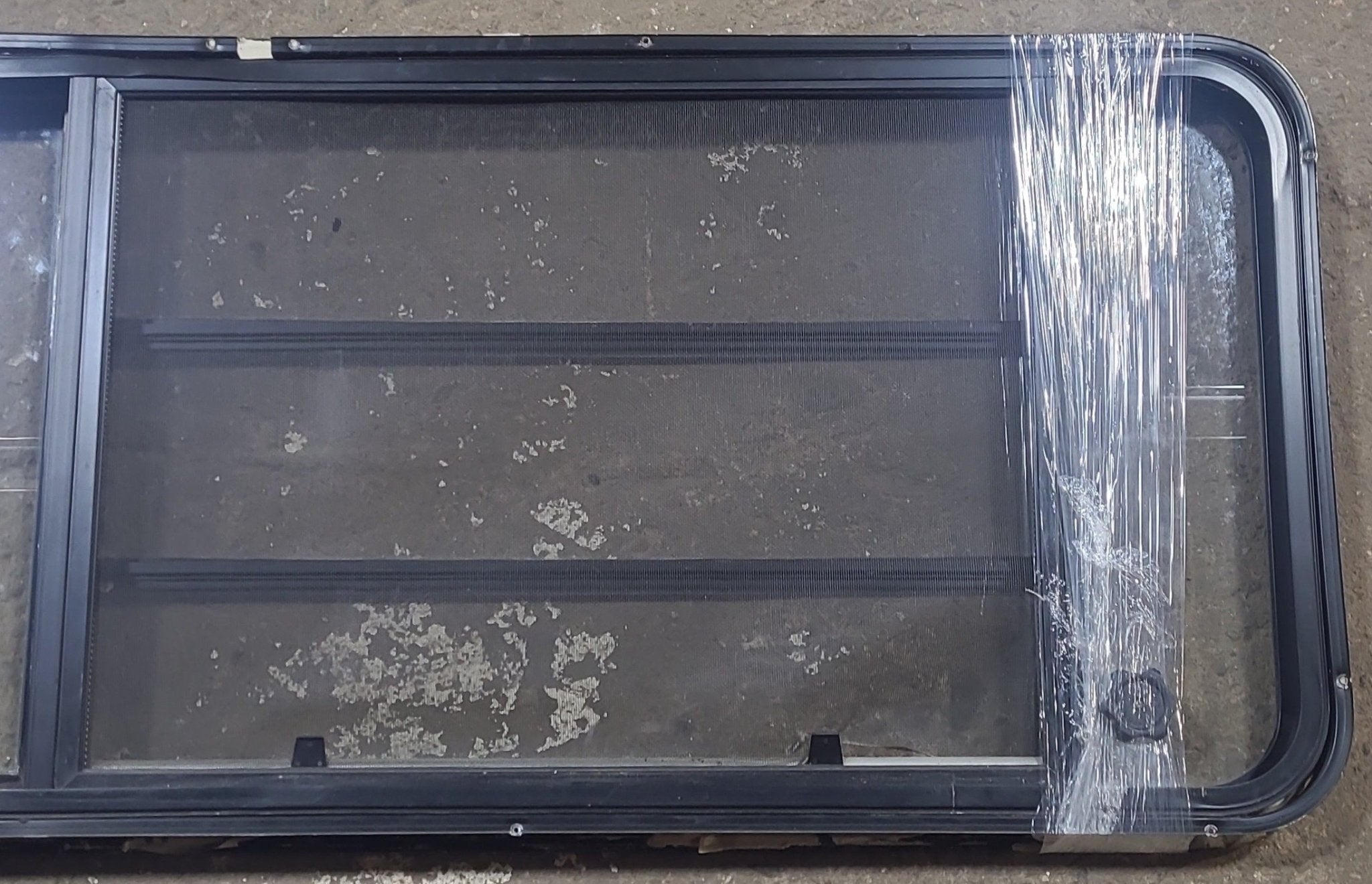 Used Black Radius Emergency Opening Window : 21 3/4" W x 59 3/4" H x 1 1/4" D - Young Farts RV Parts