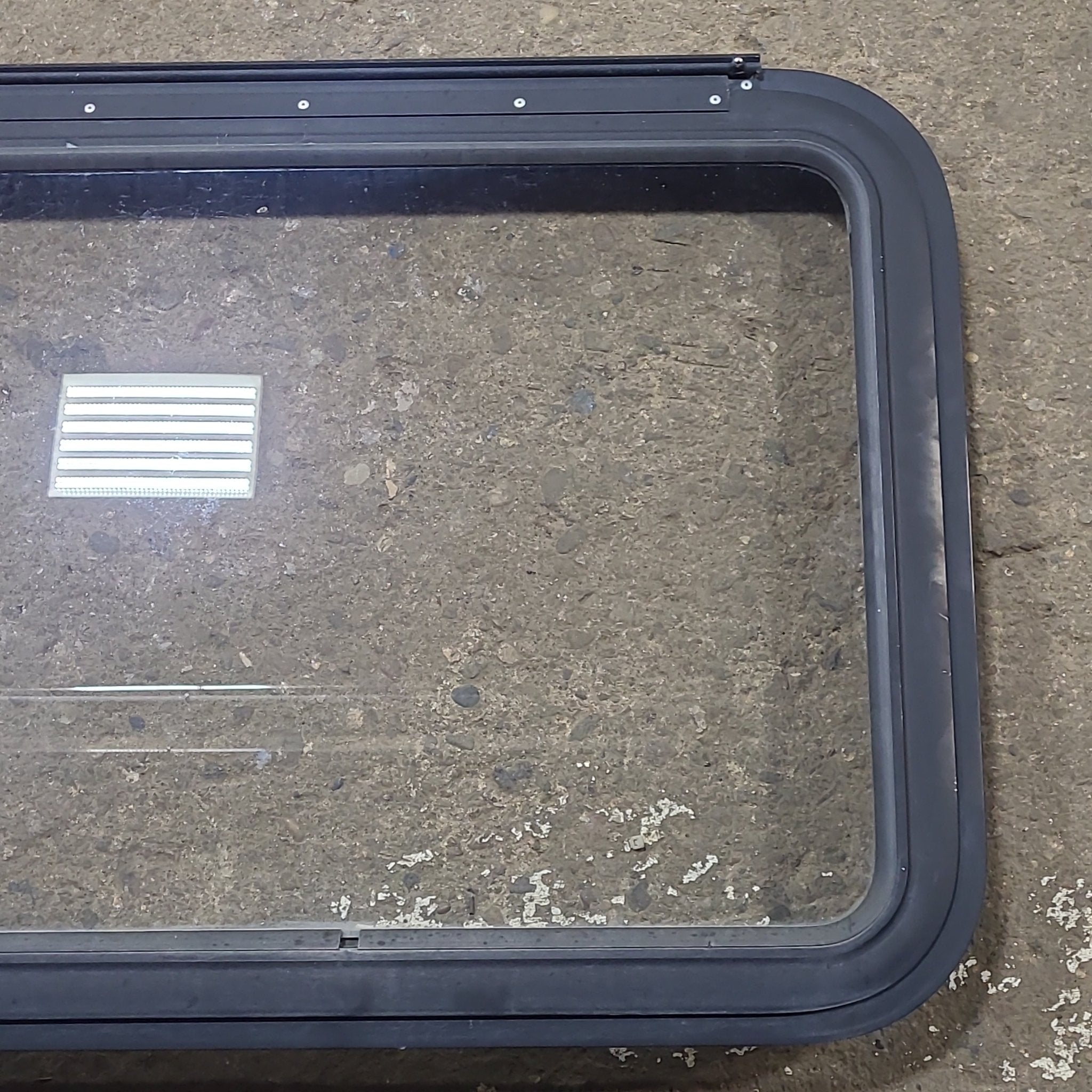 Used Black Radius Emergency Opening Window : 29 1/2" W x 21 1/2" H x 1 13/8" D - Young Farts RV Parts