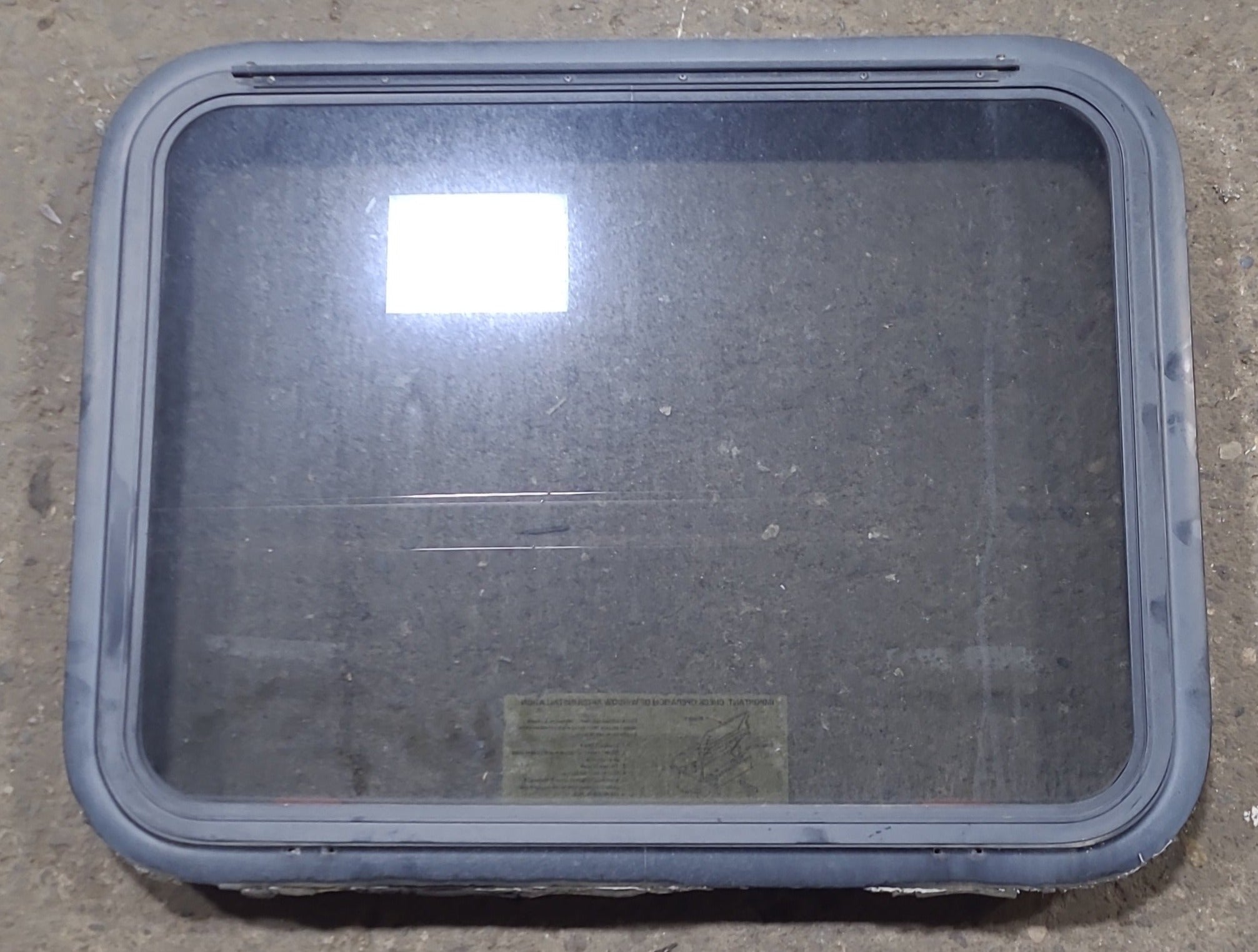 Used Black Radius Emergency Opening Window : 29 3/8" W x 22 1/2" H x 1 7/8" D - Young Farts RV Parts