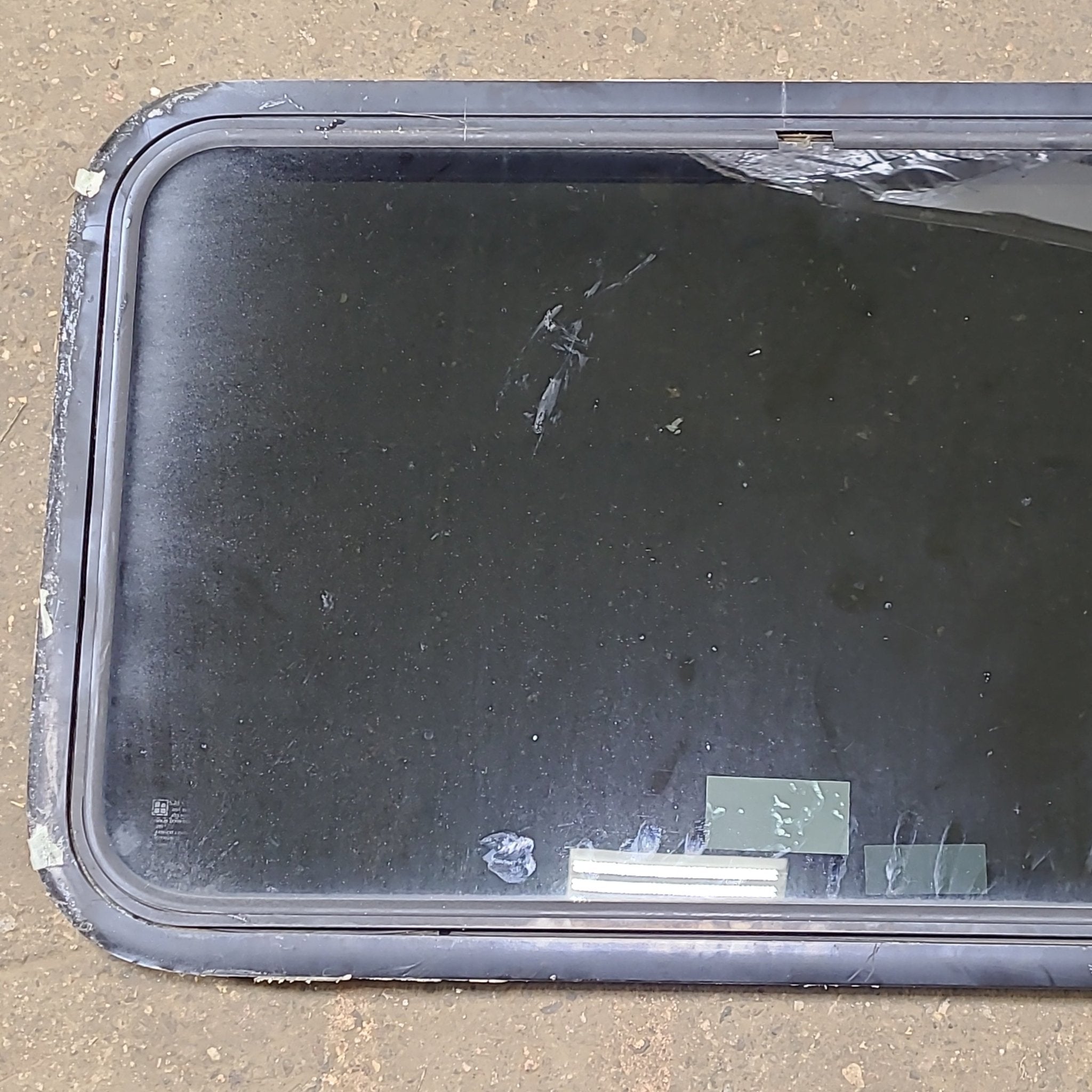 Used Black Radius Emergency Opening Window : 35 1/2" W x 21 1/2" H x 1 1/4" D - Young Farts RV Parts