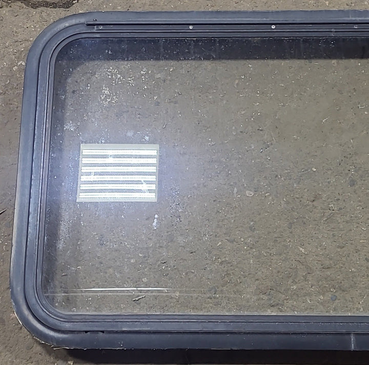Used Black Radius Emergency Opening Window : 35 1/2" W x 21 1/2" H x 1 7/8" D - Young Farts RV Parts