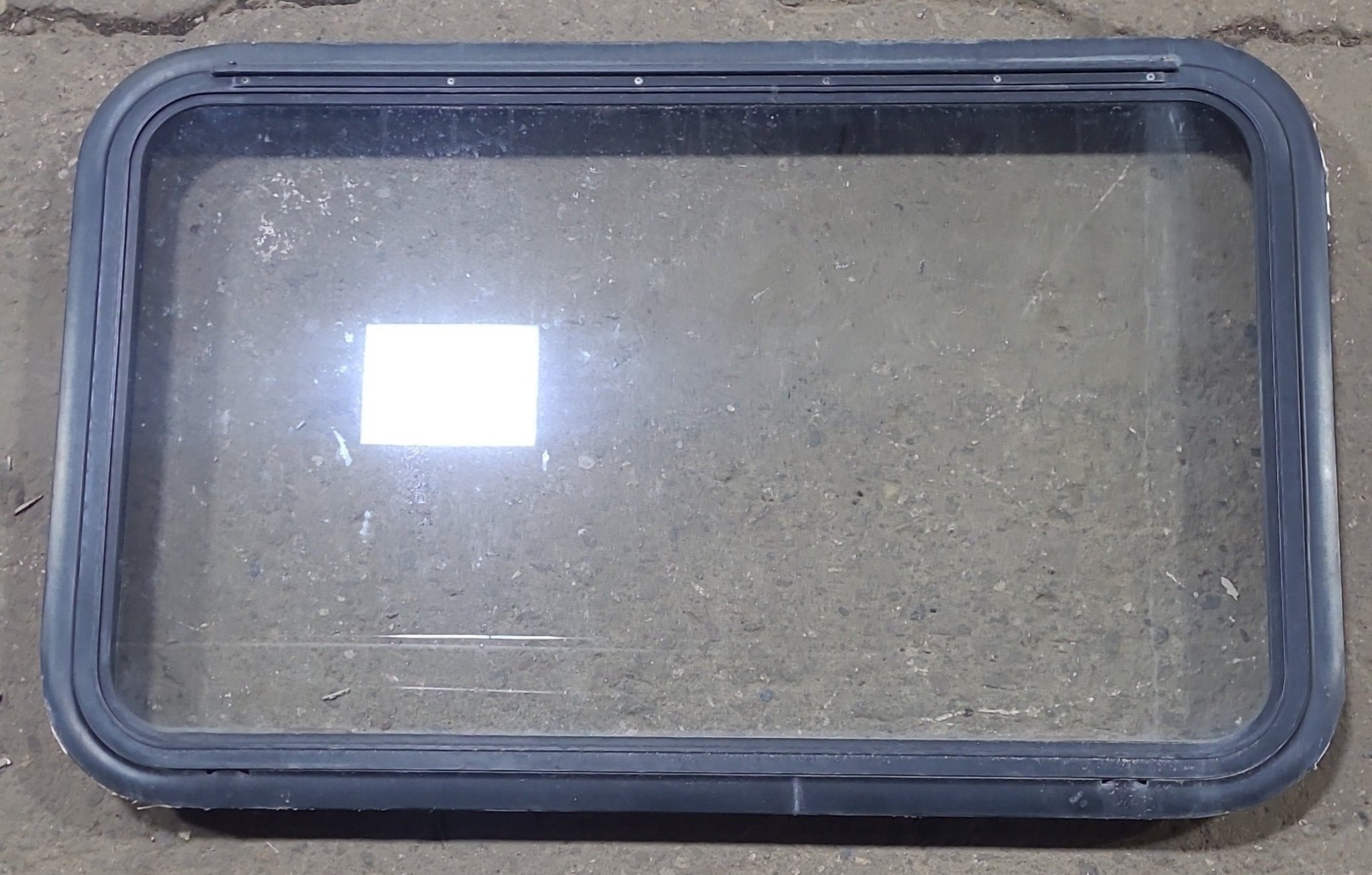 Used Black Radius Emergency Opening Window : 35 1/2" W x 21 1/2" H x 1 7/8" D - Young Farts RV Parts