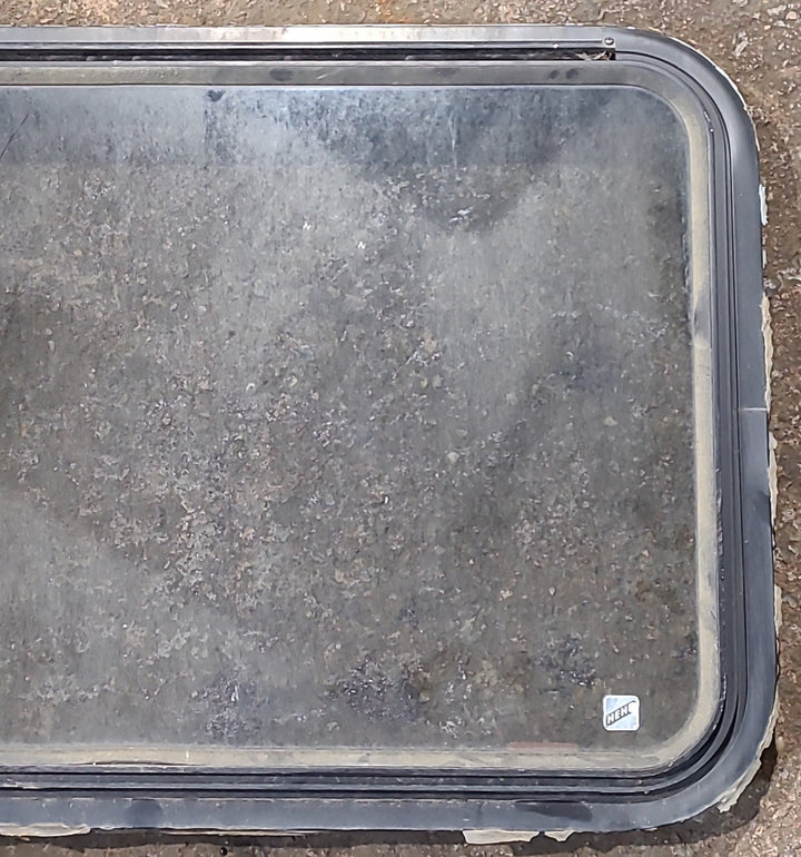 Used Black Radius Emergency Opening Window : 35 1/2" W x 21 3/4" H x 1 5/8" D - Young Farts RV Parts