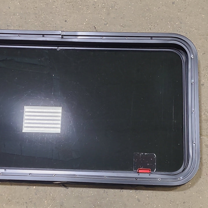 Used Black Radius Emergency Opening Window : 41 3/8" W X 21 1/4" H X 2" D - Young Farts RV Parts