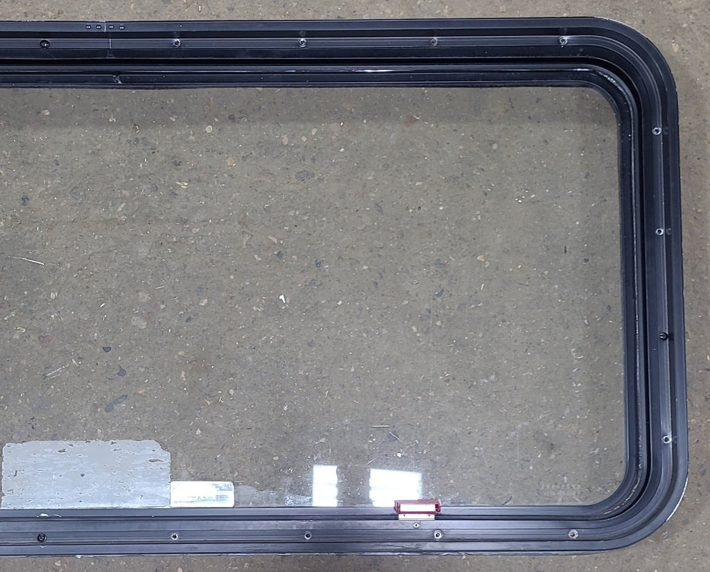 Used Black Radius Emergency Opening Window : 48 1/2" W x 21 3/4" H x 1 3/4" D - Young Farts RV Parts