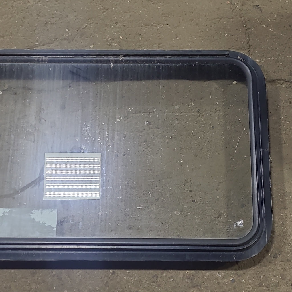 Used Black Radius Emergency Opening Window : 48 1/2" W x 22" H x 1 3/4" D - Young Farts RV Parts