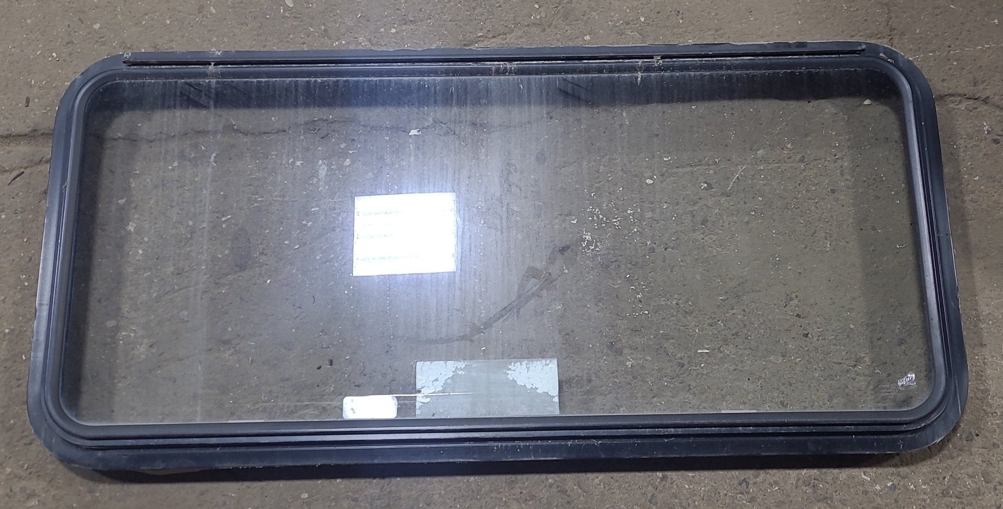 Used Black Radius Emergency Opening Window : 48 1/2" W x 22" H x 1 3/4" D - Young Farts RV Parts