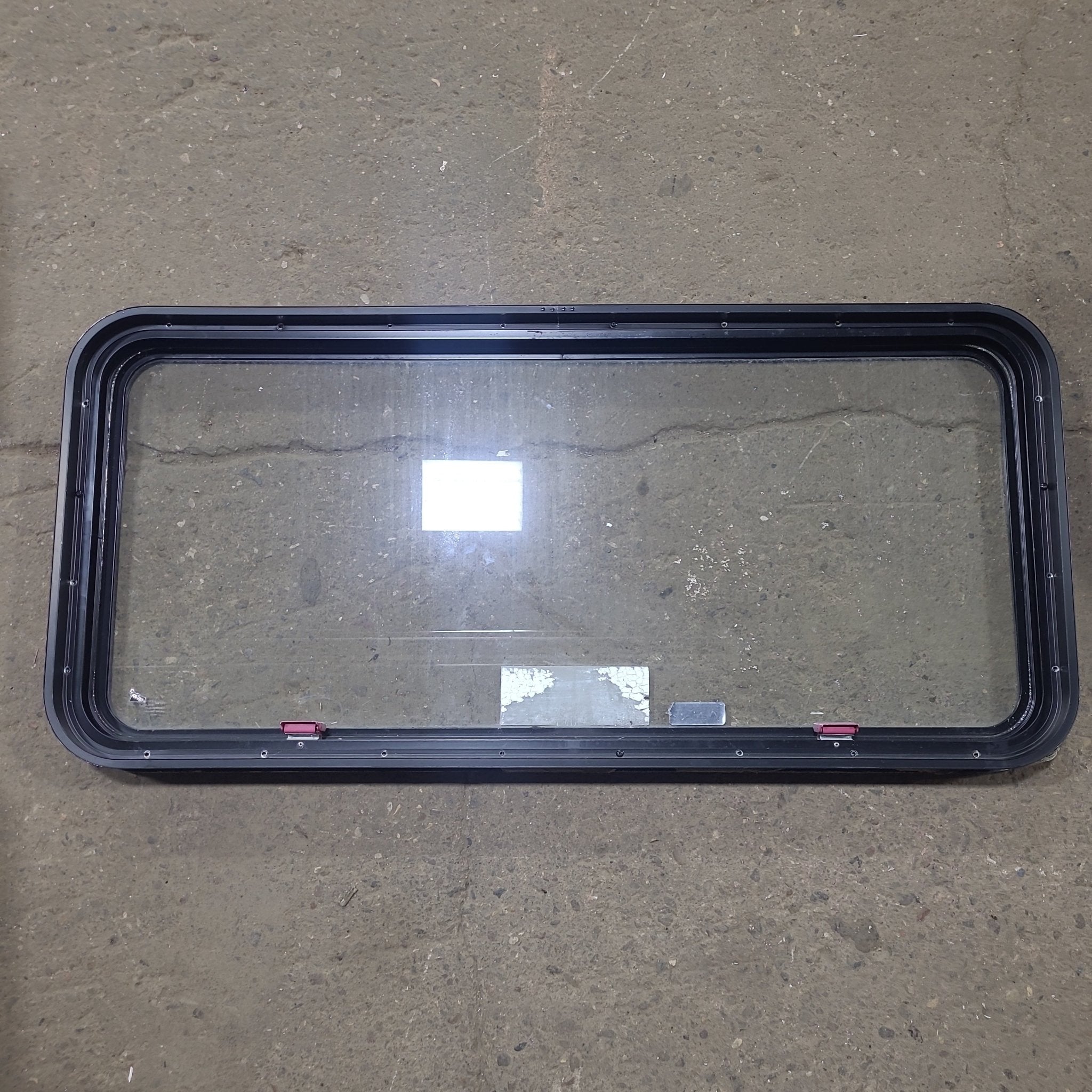 Used Black Radius Emergency Opening Window : 48 1/2" W x 22" H x 1 3/4" D - Young Farts RV Parts