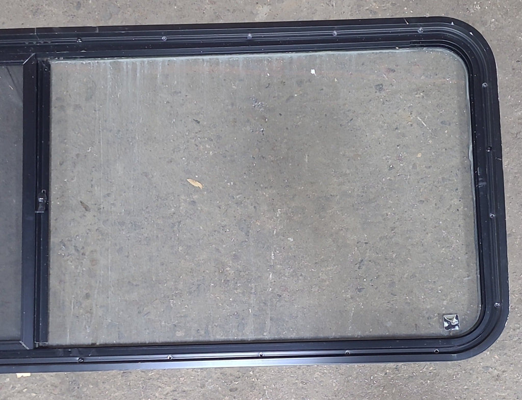 Used Black Radius Emergency Opening Window : 60 3/8" W x 21 3/4" H x 1 3/4" D - Young Farts RV Parts