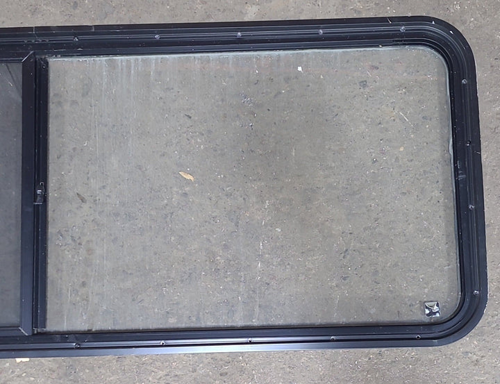 Used Black Radius Emergency Opening Window : 60 3/8" W x 21 3/4" H x 1 3/4" D - Young Farts RV Parts