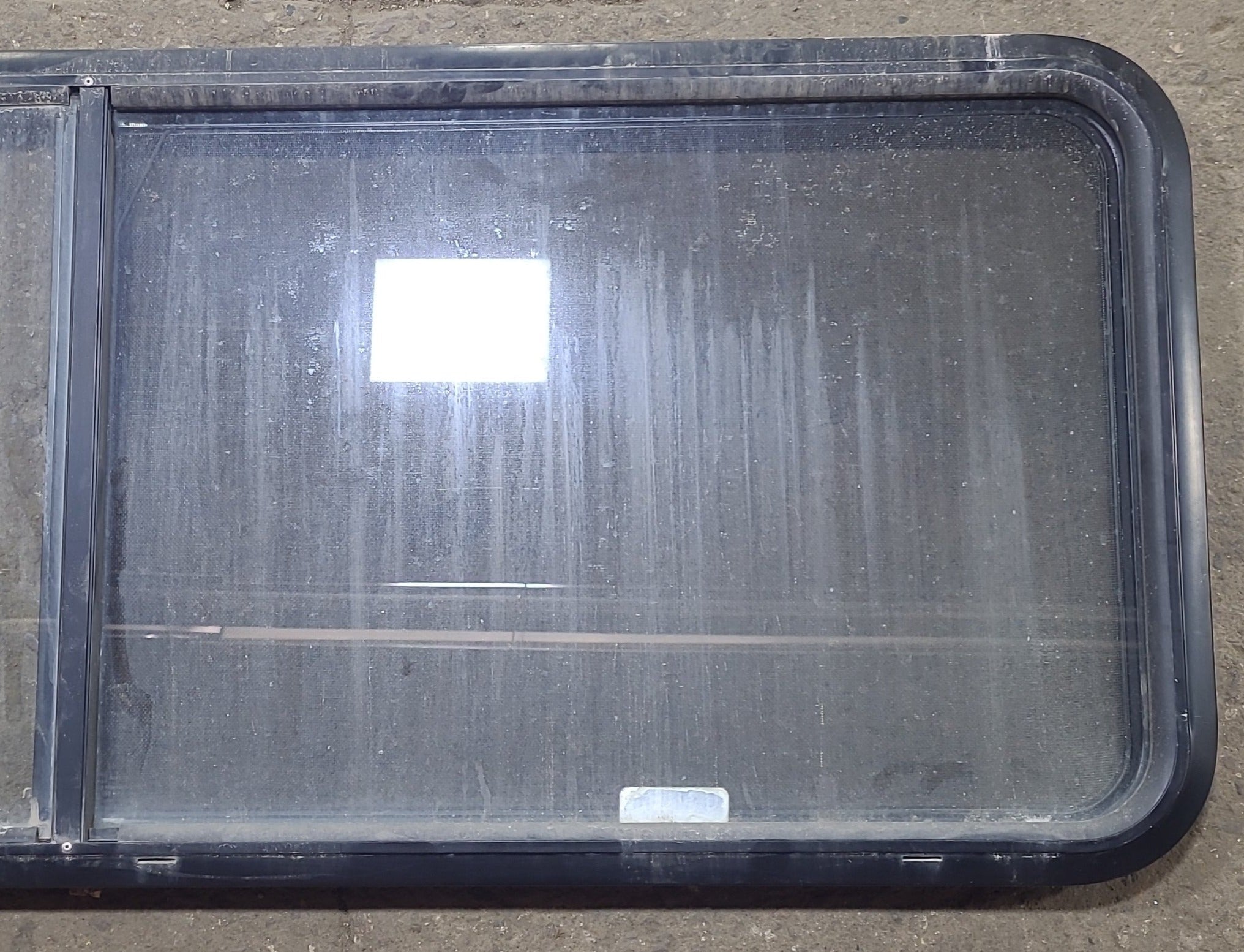 Used Black Radius Emergency Opening Window : 60 3/8" W x 21 3/4" H x 1 3/4" D - Young Farts RV Parts