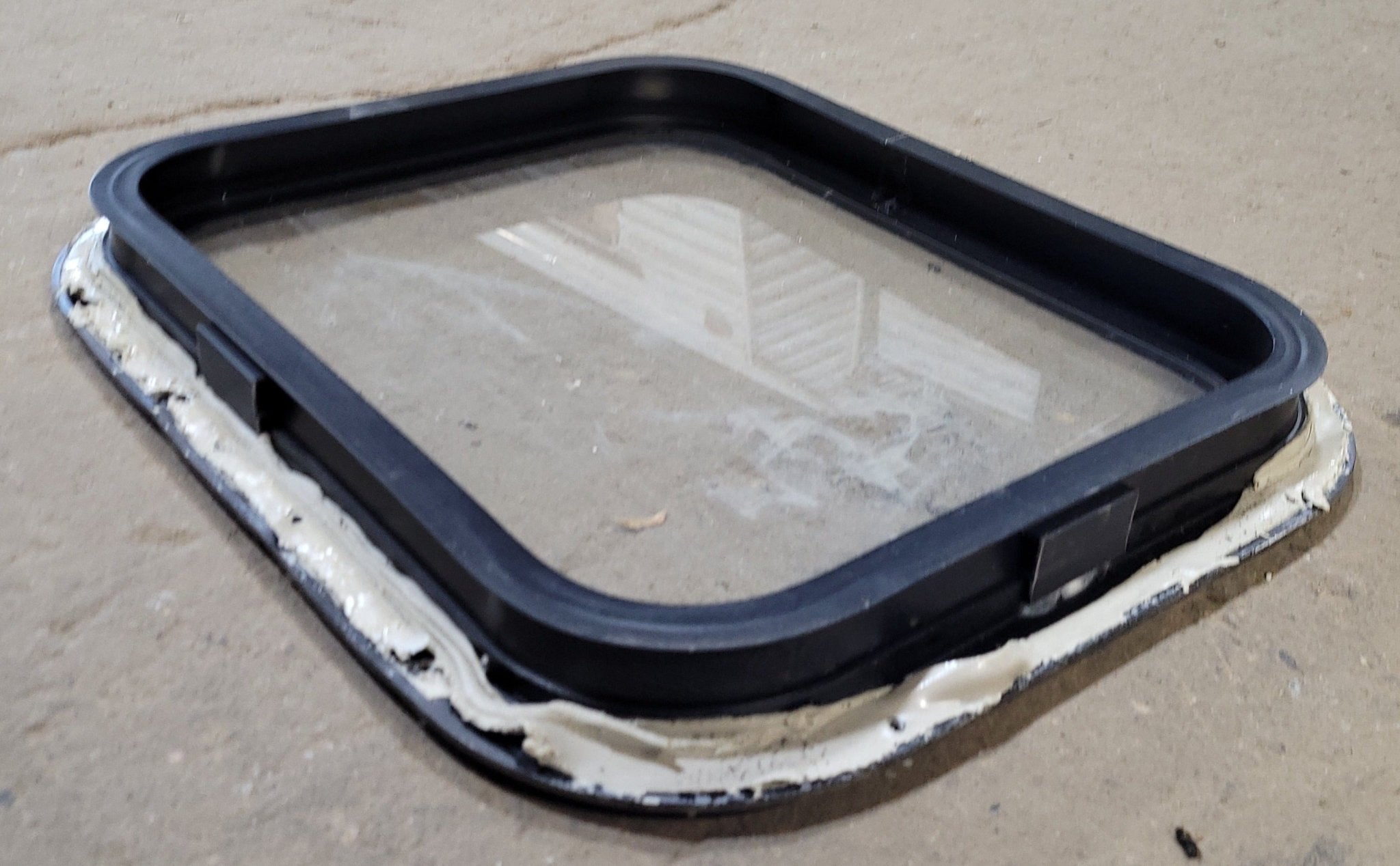 Used Black Radius Non-Opening Window : 16 3/4" W X 19 3/4" H X 1 1/2" D - Young Farts RV Parts