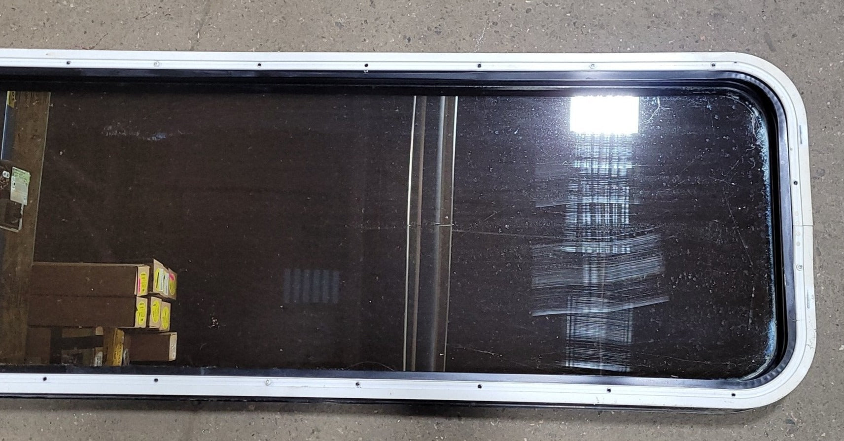 Used Black Radius Non-Opening Window : 16 3/4" W X 59 1/2" H X 1 7/8" D - Young Farts RV Parts