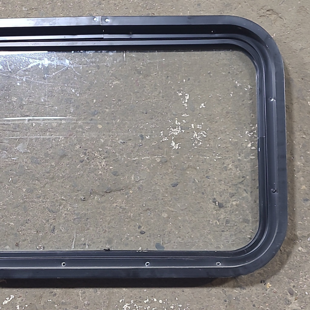 Used Black Radius Non Opening Window : 24 1/4" W x 16 3/4" H x 1 7/8" D - Young Farts RV Parts