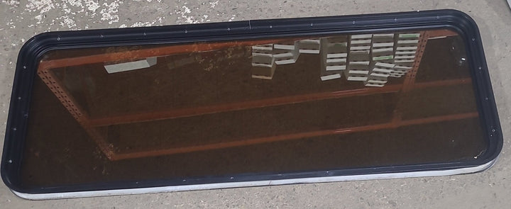 Used Black Radius Non Opening Window : 60 1/2" W x 21 3/4" H x 1 7/8" D - Young Farts RV Parts