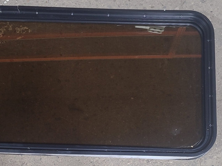 Used Black Radius Non Opening Window : 60 1/2" W x 21 3/4" H x 1 7/8" D - Young Farts RV Parts