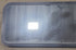 Used Black Radius Non Opening Window : 60 1/2" W x 21 3/4" H x 1 7/8" D - Young Farts RV Parts