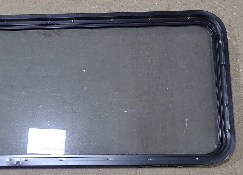 Used Black Radius Non Opening Window : 60 1/4" W x 21 3/4" H x 1 3/4" D - Young Farts RV Parts