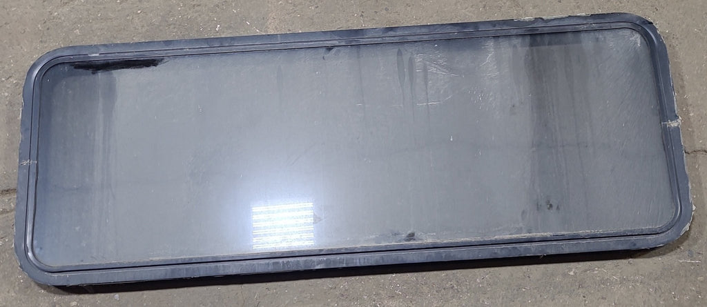 Used Black Radius Non Opening Window : 60 1/4" W x 21 3/4" H x 1 3/4" D - Young Farts RV Parts